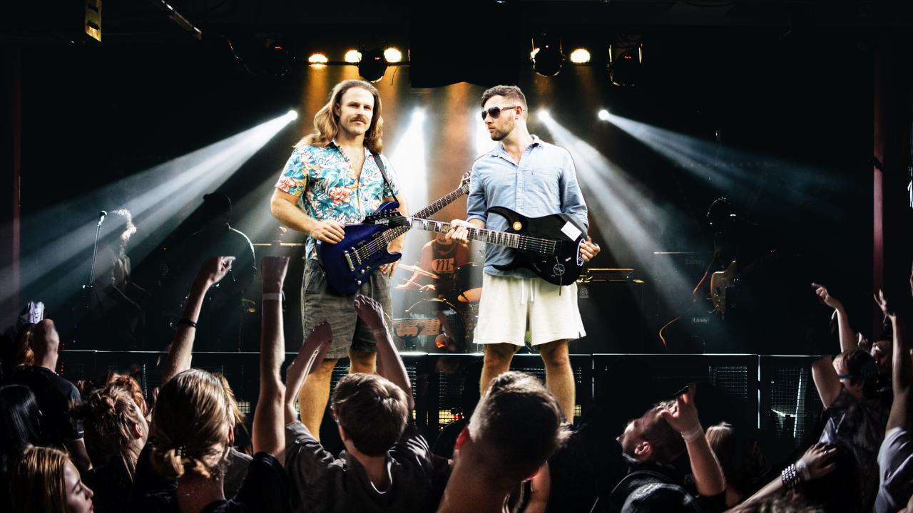The Sovereigntees band members on stage for millions of fans